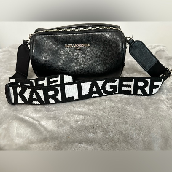 Karl Lagerfeld Handbags - Karl Lagerfeld Paris Black Pebbled Barrel Crossbody Bag with Logo Guitar Strap